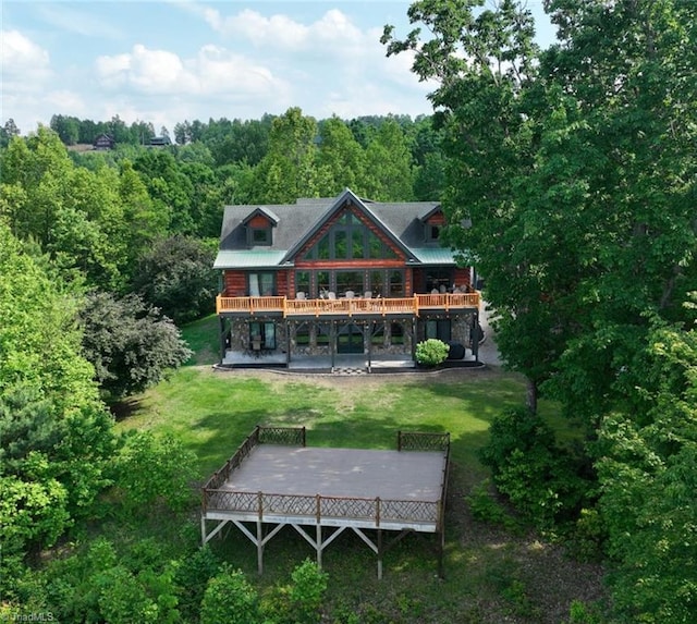650 Sweetwater Rd, Boomer, NC 28606 - rear view of property featuring a deck, a lawn, and a forest view