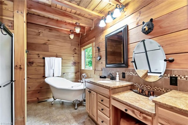 650 Sweetwater Rd, Boomer, NC 28606 - full bathroom with decorative backsplash, wood walls, a freestanding tub, wood ceiling with exposed beams, and vanity