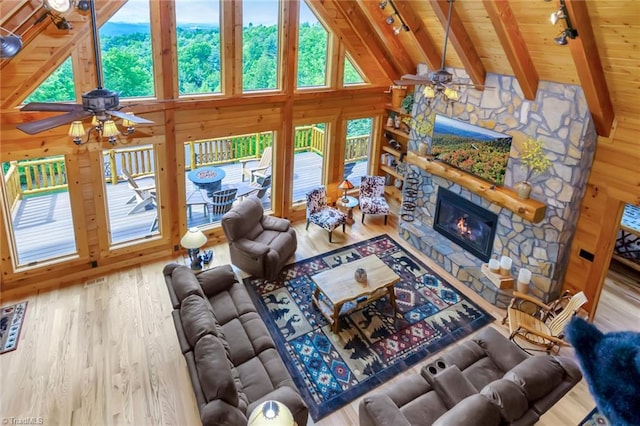 650 Sweetwater Rd, Boomer, NC 28606 - living area featuring ceiling fan, rail lighting, wood finished floors, wooden ceiling, and a fireplace