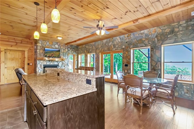 650 Sweetwater Rd, Boomer, NC 28606 - kitchen with wooden ceiling, dark brown cabinetry, a fireplace, ceiling fan, and open floor plan