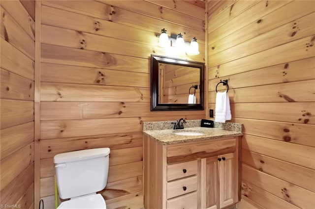 650 Sweetwater Rd, Boomer, NC 28606 - bathroom featuring wooden walls, toilet, and vanity