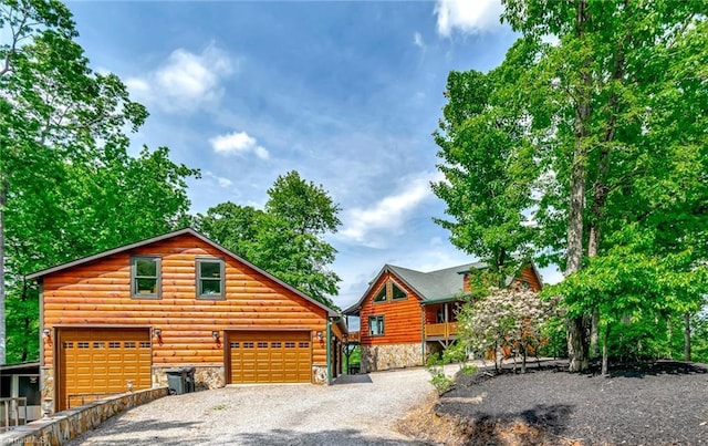 650 Sweetwater Rd, Boomer, NC 28606 - log home featuring stone siding, gravel driveway, and faux log siding