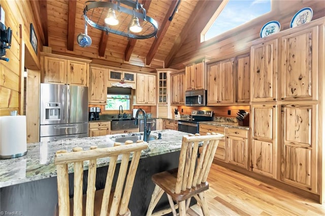 650 Sweetwater Rd, Boomer, NC 28606 - kitchen featuring stainless steel appliances, a sink, wood ceiling with exposed beams, light wood-style flooring, and light stone countertops