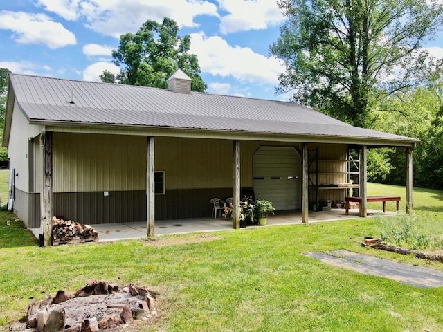 431 Needham Rd, Pilot Mountain, NC 27041 - back of house featuring a lawn, metal roof, and a chimney