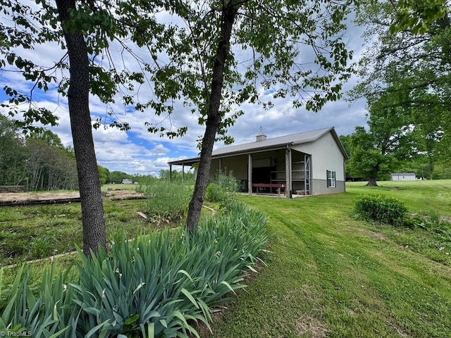 431 Needham Rd, Pilot Mountain, NC 27041 - view of green lawn with a pole building and an outdoor structure