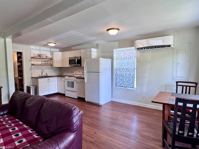 431 Needham Rd, Pilot Mountain, NC 27041 - kitchen with white appliances, a wall mounted air conditioner, a sink, dark countertops, and open shelves