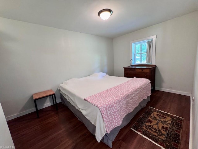 431 Needham Rd, Pilot Mountain, NC 27041 - bedroom featuring dark wood-style floors and baseboards