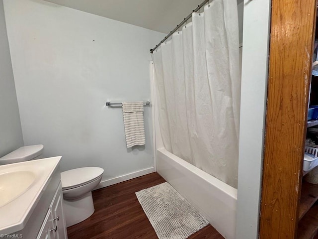 431 Needham Rd, Pilot Mountain, NC 27041 - bathroom with wood finished floors, vanity, toilet, shower / tub combo with curtain, and baseboards