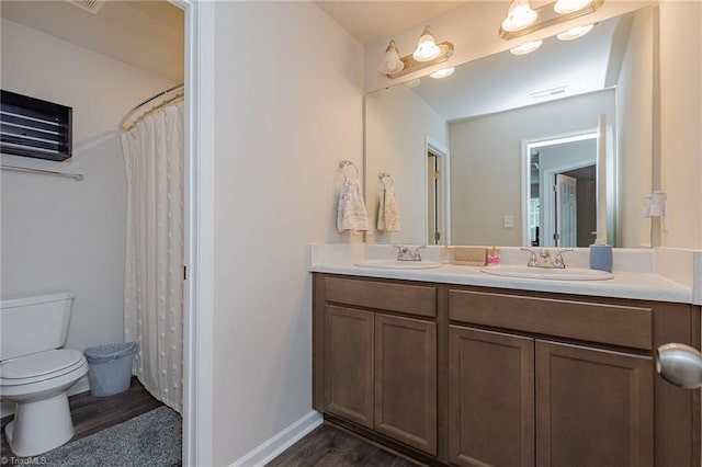 1765 Midway School Rd, Winston-Salem, NC 27107 - full bath featuring double vanity, toilet, wood finished floors, and a sink
