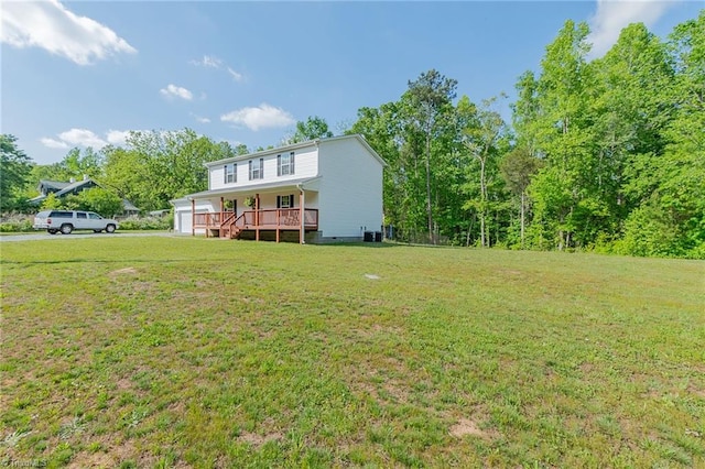 1765 Midway School Rd, Winston-Salem, NC 27107 - rear view of property featuring a garage, a porch, and a lawn