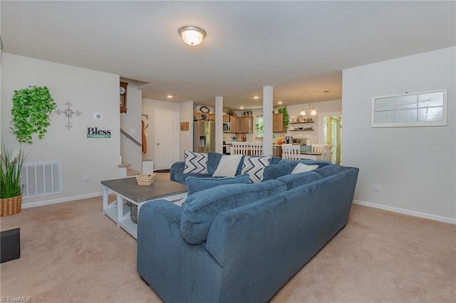 1765 Midway School Rd, Winston-Salem, NC 27107 - living area featuring light colored carpet, visible vents, baseboards, and a notable chandelier