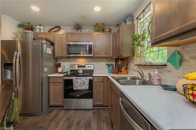 1765 Midway School Rd, Winston-Salem, NC 27107 - kitchen featuring a sink, stainless steel appliances, light countertops, and dark wood-type flooring