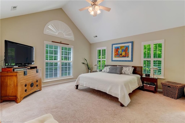 bedroom with high vaulted ceiling, visible vents, a ceiling fan, and light colored carpet