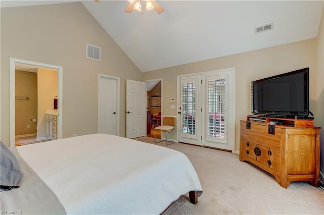 bedroom featuring high vaulted ceiling, access to outside, light carpet, and visible vents