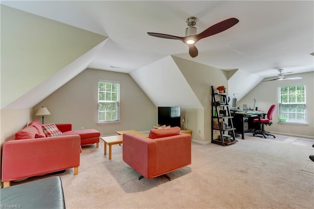 carpeted living room featuring a ceiling fan, baseboards, and lofted ceiling