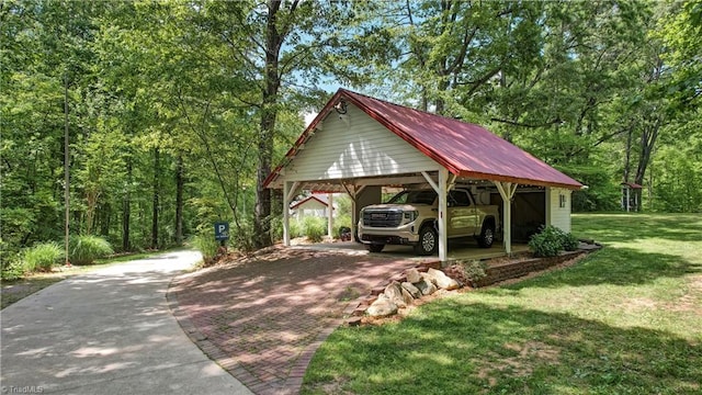 exterior space with decorative driveway and a carport