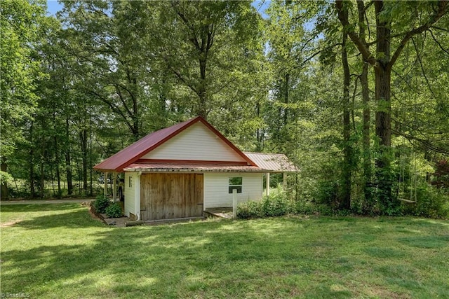 view of outdoor structure with a forest view