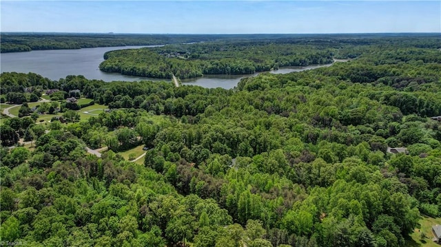 aerial view featuring a water view and a forest view