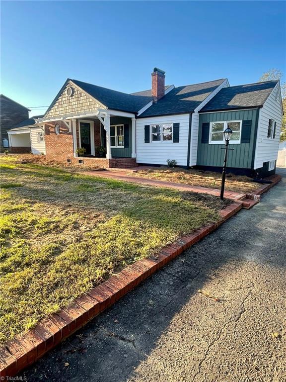 14551 Elkin Highway 268, Ronda, NC 28670 - single story home featuring a front yard and a chimney