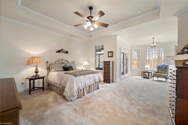 bedroom with a raised ceiling, carpet flooring, crown molding, and baseboards