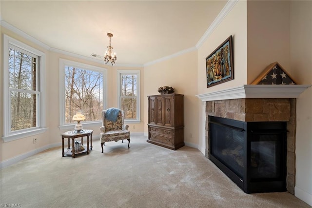 living area featuring carpet flooring, baseboards, a glass covered fireplace, and crown molding