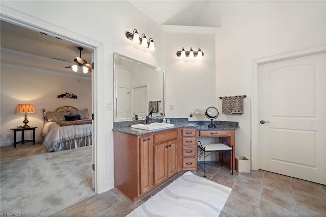 ensuite bathroom featuring ensuite bath, vanity, ceiling fan, and ornamental molding