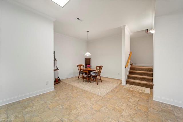 dining area featuring visible vents, ornamental molding, stone finish floor, baseboards, and stairs