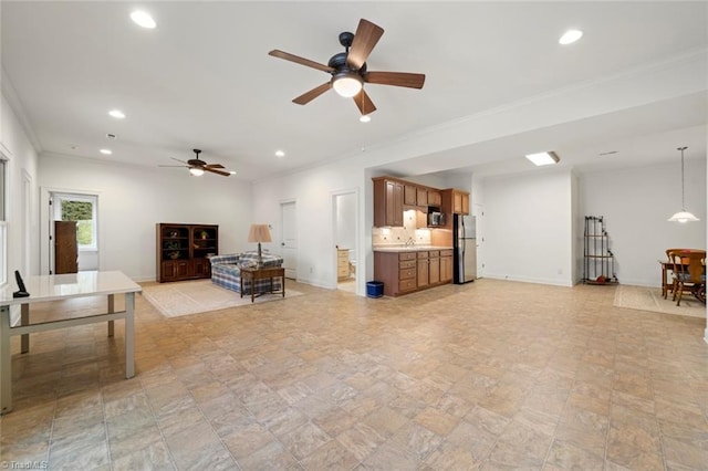 living area with recessed lighting, baseboards, and ornamental molding