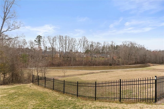 view of yard featuring a rural view and fence