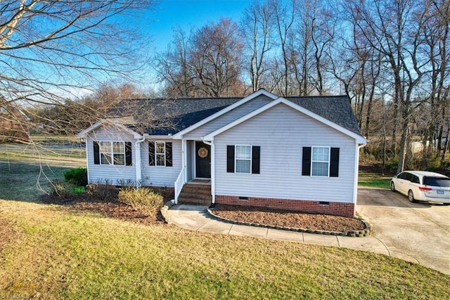 ranch-style home with driveway, a shingled roof, crawl space, and a front yard