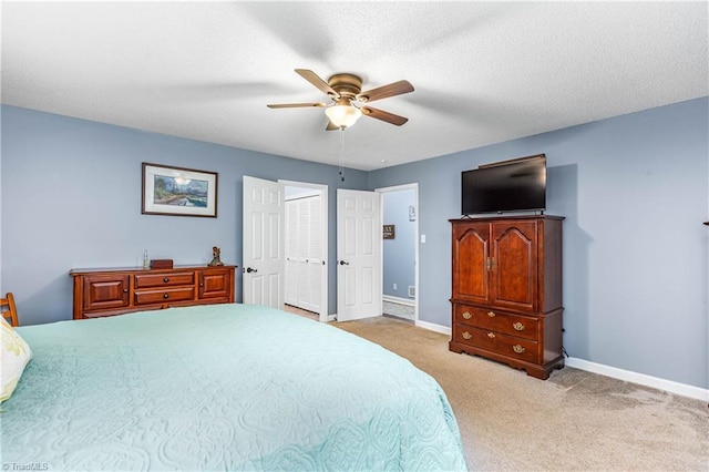 2215 Hickswood Rd, High Point, NC 27265 - carpeted bedroom featuring a ceiling fan and a closet