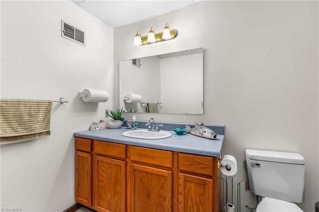 2215 Hickswood Rd, High Point, NC 27265 - half bathroom featuring vanity and toilet