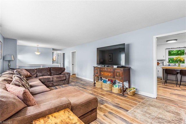2215 Hickswood Rd, High Point, NC 27265 - living area with light wood-style flooring and baseboards