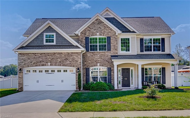 craftsman-style house featuring a front yard and a garage