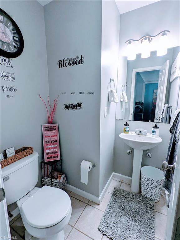 bathroom with tile patterned floors and toilet