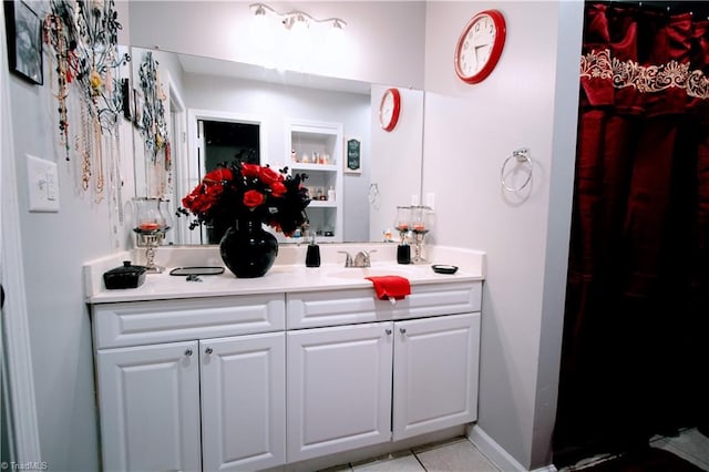 bathroom with vanity and tile patterned floors