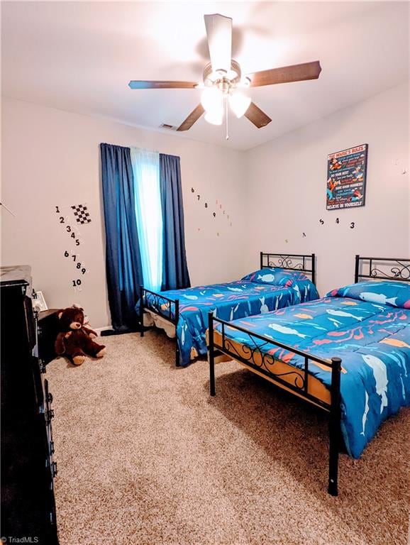 bedroom featuring carpet floors and ceiling fan