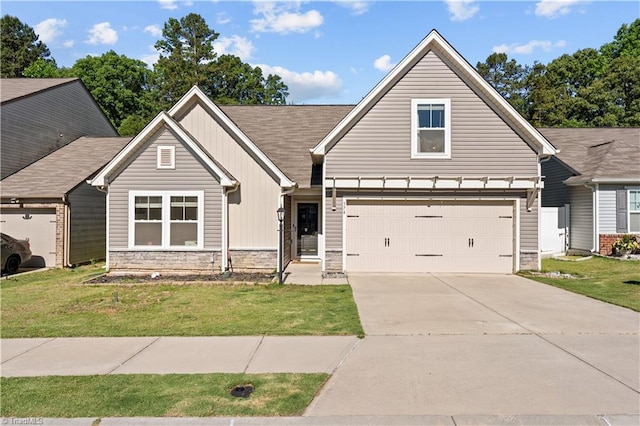 574 Freeport Ct, Winston-Salem, NC 27127 - view of front of home featuring stone siding, concrete driveway, board and batten siding, and a front yard