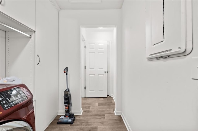 574 Freeport Ct, Winston-Salem, NC 27127 - laundry area with washer / dryer, light wood-style flooring, and baseboards