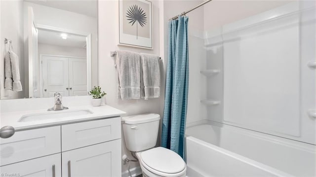 full bathroom featuring shower / bath combination with curtain, vanity, and toilet