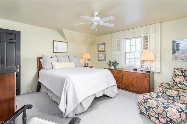 bedroom with vaulted ceiling, baseboards, a ceiling fan, and carpet flooring