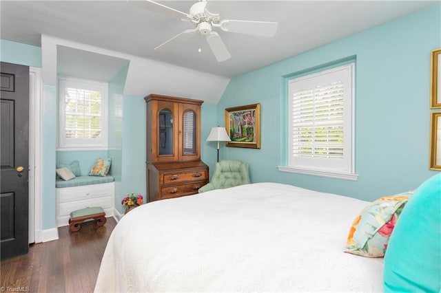 bedroom with baseboards, a ceiling fan, dark wood-style flooring, and vaulted ceiling