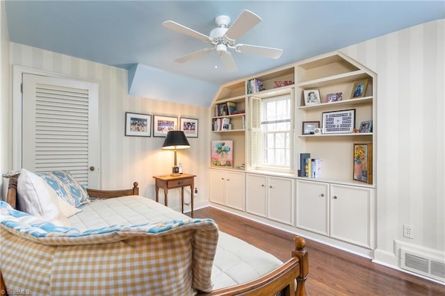 bedroom with baseboards, dark wood-style floors, and visible vents