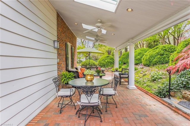 view of patio featuring ceiling fan and outdoor dining space