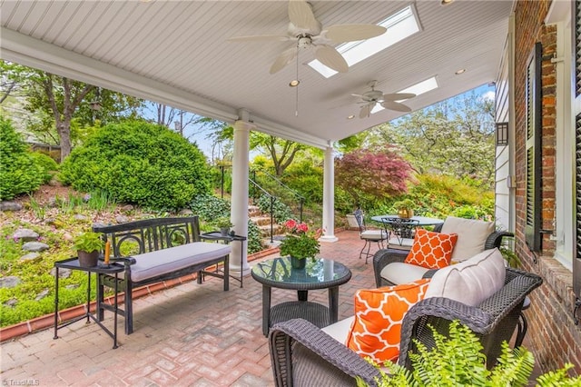 view of patio / terrace featuring outdoor dining space, ceiling fan, and outdoor lounge area