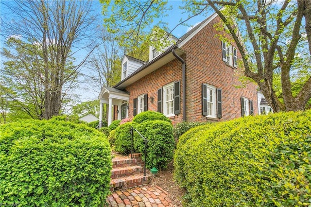 view of home's exterior featuring brick siding