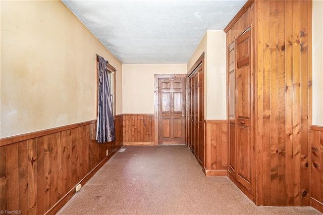3753 Konnoak Dr SW, Winston-Salem, NC 27127 - hallway with wood walls, wainscoting, carpet flooring, and a textured ceiling