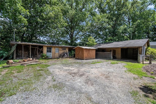 3753 Konnoak Dr SW, Winston-Salem, NC 27127 - view of front facade with an exterior structure, driveway, and a shed