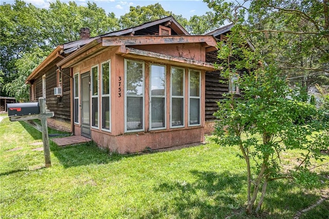 3753 Konnoak Dr SW, Winston-Salem, NC 27127 - view of side of property with a chimney and a lawn