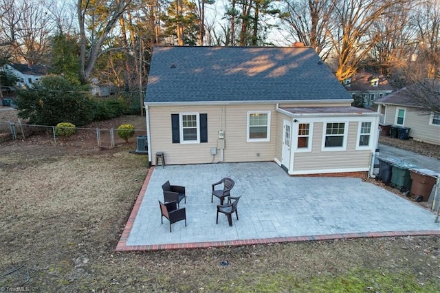 back of property featuring a patio area and central air condition unit